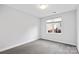 Bright bedroom with grey carpet and large window at 916-A Westbrook Dr, Charlotte, NC 28202