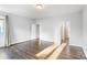 Spacious bedroom with hardwood floors and access to bathroom at 916-A Westbrook Dr, Charlotte, NC 28202