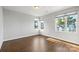 Bright bedroom with hardwood floors and large windows at 916-A Westbrook Dr, Charlotte, NC 28202