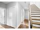 Clean hallway with hardwood floors and modern staircase at 916-A Westbrook Dr, Charlotte, NC 28202
