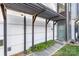 Modern house entrance with a pergola and green door at 916-A Westbrook Dr, Charlotte, NC 28202