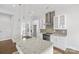 Modern kitchen with white cabinets and granite countertops at 916-A Westbrook Dr, Charlotte, NC 28202