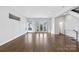Open living space with hardwood floors and access to balcony at 916-A Westbrook Dr, Charlotte, NC 28202