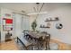 Dining area with modern light fixture, blue patterned rug and window with light at 1000 E Woodlawn Rd # 415, Charlotte, NC 28209