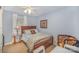 Serene bedroom featuring a wooden bed frame, soft lighting, and cozy decor at 15450 Millview Trace Ln, Mint Hill, NC 28227