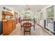 Sunlit dining area with vaulted ceiling and access to the outdoor deck at 15450 Millview Trace Ln, Mint Hill, NC 28227