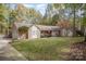 Charming home featuring a well-maintained lawn, stone accents, and an inviting entrance at 15450 Millview Trace Ln, Mint Hill, NC 28227