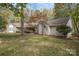 House exterior with stone accents and landscaping at 15450 Millview Trace Ln, Mint Hill, NC 28227