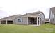 Manicured backyard with newly installed sod and patio of newly constructed home at 4440 Moxie Way, Charlotte, NC 28215