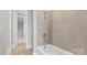 Tiled shower and tub combo with modern fixtures, creating a spa-like experience at 4440 Moxie Way, Charlotte, NC 28215