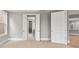 Bright bedroom features neutral carpet, gray walls, natural light and access to closet and en suite bathroom at 4440 Moxie Way, Charlotte, NC 28215