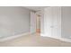 Neutral bedroom with white trim and light tan carpet, offering a serene atmosphere at 4440 Moxie Way, Charlotte, NC 28215