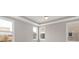Bright bedroom with tray ceilings, lots of natural light from three large windows, and neutral paint at 4440 Moxie Way, Charlotte, NC 28215