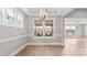 Bright dining room with lots of natural light, and modern globe chandelier at 4440 Moxie Way, Charlotte, NC 28215