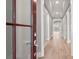 Hallway with hardwood floors offers a glimpse into other rooms and abundant natural light at 4440 Moxie Way, Charlotte, NC 28215