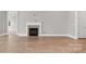Living room featuring a fireplace and neutral colors at 4440 Moxie Way, Charlotte, NC 28215