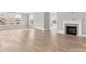 Open living room with fireplace and lots of natural light from large windows at 4440 Moxie Way, Charlotte, NC 28215
