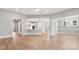 Bright, open-concept living room with recessed lighting and easy access to the kitchen at 4440 Moxie Way, Charlotte, NC 28215