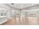 Spacious living area with light hardwood floors, ceiling fans and lots of natural light at 4440 Moxie Way, Charlotte, NC 28215