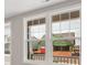 A view of the neighborhood through bright, new white-framed windows at 4440 Moxie Way, Charlotte, NC 28215