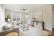 Bright living room with a neutral color scheme, plush rug, and ample seating at 8021 Joy Crossing Ln, Charlotte, NC 28214
