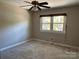 Spacious bedroom with carpeted floor and ceiling fan at 18140 Nantz Rd, Cornelius, NC 28031