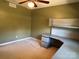 Bedroom with neutral walls, carpet, and built-in desk at 18140 Nantz Rd, Cornelius, NC 28031