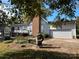 Backyard view of house with deck and attached garage at 18140 Nantz Rd, Cornelius, NC 28031