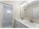 Modern bathroom featuring double sinks, a large mirror, and neutral walls at 1914 Irma St, Charlotte, NC 28216