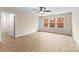 Bedroom featuring luxury vinyl flooring, neutral walls, and natural light at 1914 Irma St, Charlotte, NC 28216