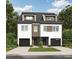 Modern two-story home showcasing a two-car garage and a well-maintained lawn at 1914 Irma St, Charlotte, NC 28216