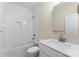 Bathroom with a single sink vanity, quartz countertop, and a shower and bathtub combo at 1916 Irma St, Charlotte, NC 28216