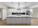 The expansive kitchen island is great for cooking and entertaining in this modern space at 1916 Irma St, Charlotte, NC 28216