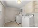 Laundry room with washer, dryer, and ample storage space at 5070 Woodleaf Rd, Salisbury, NC 28147