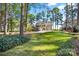 Spacious backyard with lush lawn and mature trees at 806 Lake Mist Dr, Stanley, NC 28164