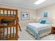 Bedroom with a queen bed, bunk beds, and teal accents at 806 Lake Mist Dr, Stanley, NC 28164