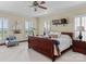 Main bedroom with large windows, wooden furniture, and carpeted floor at 806 Lake Mist Dr, Stanley, NC 28164