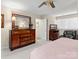 Spacious bedroom with a dresser, chair, and large bed at 806 Lake Mist Dr, Stanley, NC 28164