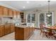 Spacious kitchen with island, granite countertops, and stainless steel appliances at 806 Lake Mist Dr, Stanley, NC 28164