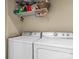 Laundry room with washer, dryer, and ample shelving at 806 Lake Mist Dr, Stanley, NC 28164