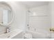 Bathroom showcasing a white vanity, toilet, and shower-tub combination at 9424 Lexington Cir # F, Charlotte, NC 28213