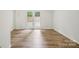 Bedroom with hardwood floors and French doors that lead to a private patio at 9424 Lexington Cir # F, Charlotte, NC 28213