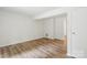 Bedroom with hardwood floors and large closet at 9424 Lexington Cir # F, Charlotte, NC 28213