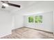 Bedroom with large windows and wood-look flooring at 9424 Lexington Cir # F, Charlotte, NC 28213