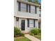 Charming townhouse with gray siding, black shutters, and a well-manicured front yard at 9424 Lexington Cir # F, Charlotte, NC 28213