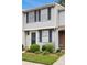 Charming townhouse with navy shutters, mature shrubs, and manicured lawn at 9424 Lexington Cir # F, Charlotte, NC 28213