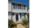 Charming two-story home with black shutters and well-maintained landscaping near the front door at 9424 Lexington Cir # F, Charlotte, NC 28213
