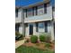 Charming two-story home with black shutters and well-maintained landscaping near the front door at 9424 Lexington Cir # F, Charlotte, NC 28213