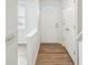 Hallway with wood-look flooring and coat closet at 9424 Lexington Cir # F, Charlotte, NC 28213