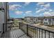 Balcony view of neighborhood featuring townhomes, parked cars and blue skies at 13047 Gadwal Pintail Dr, Charlotte, NC 28262